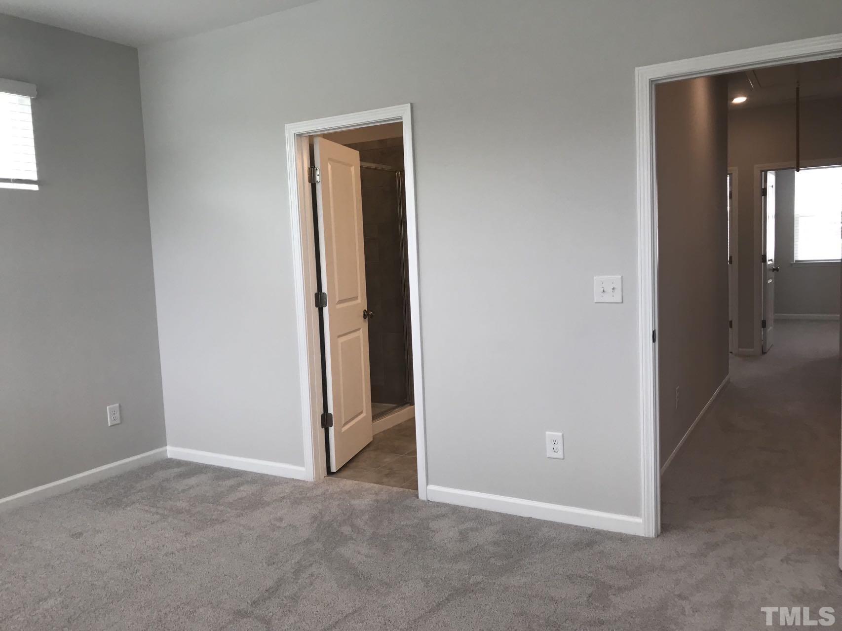 1258 Commack Drive Durham, NC 27703 - Photo 62 of 68 an empty room with closet and a bathroom