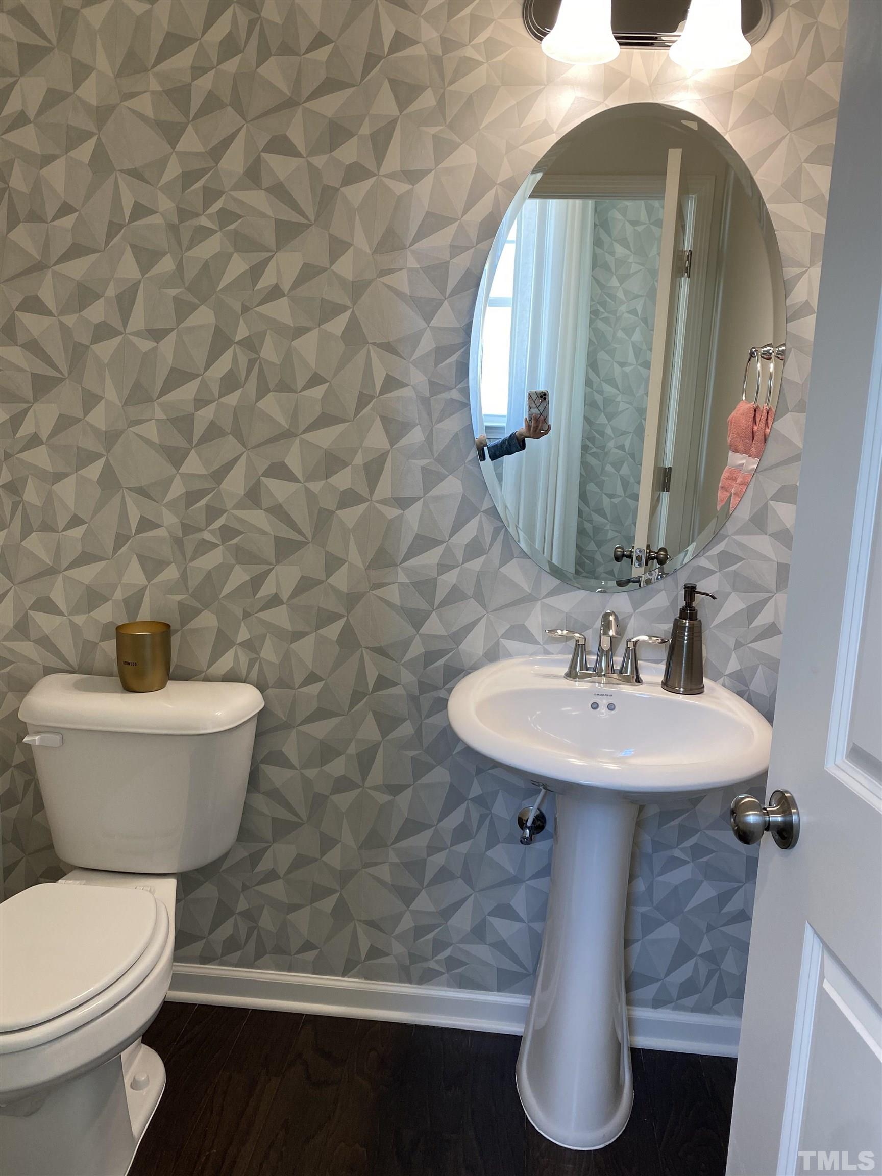 1258 Commack Drive Durham, NC 27703 - Photo 10 of 68 a bathroom with a toilet sink and mirror