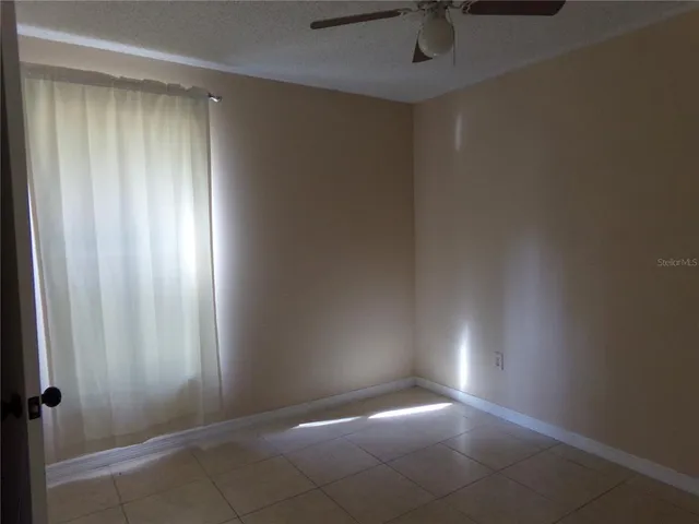 an empty room with a empty space and a window