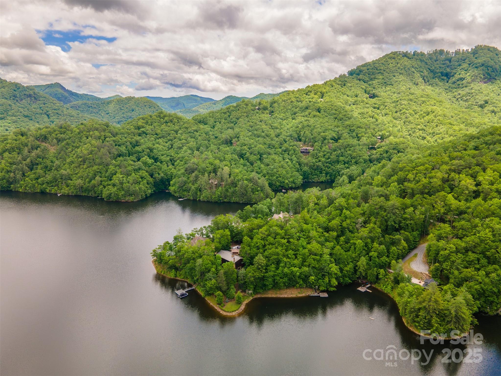 Lot 103 Longview Lane, Unit 103 Tuckasegee, NC 28783 - Photo 5 of 12 a view of a lake with a houses