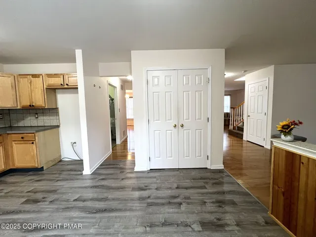 a view of a kitchen cabinets and wooden floor