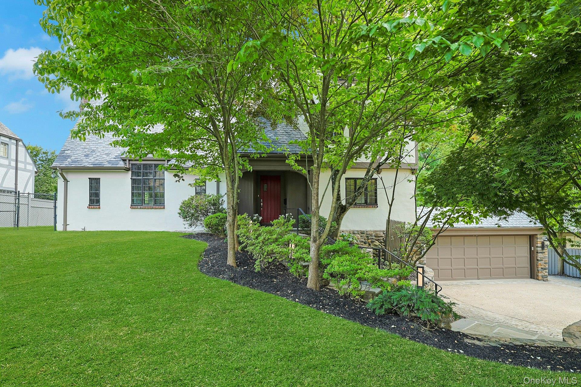 14 Withington Road Scarsdale, NY 10583 - Photo 2 of 41 front view of a house with a yard