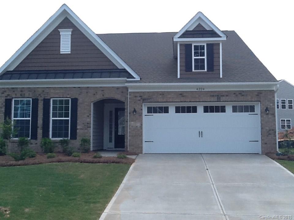 4224 Perth Road, Unit 304 Indian Land, SC 29707 - Photo 1 of 14 a front view of a house with garden