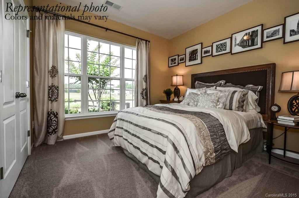 4224 Perth Road, Unit 304 Indian Land, SC 29707 - Photo 12 of 14 a bedroom with a bed and a large window