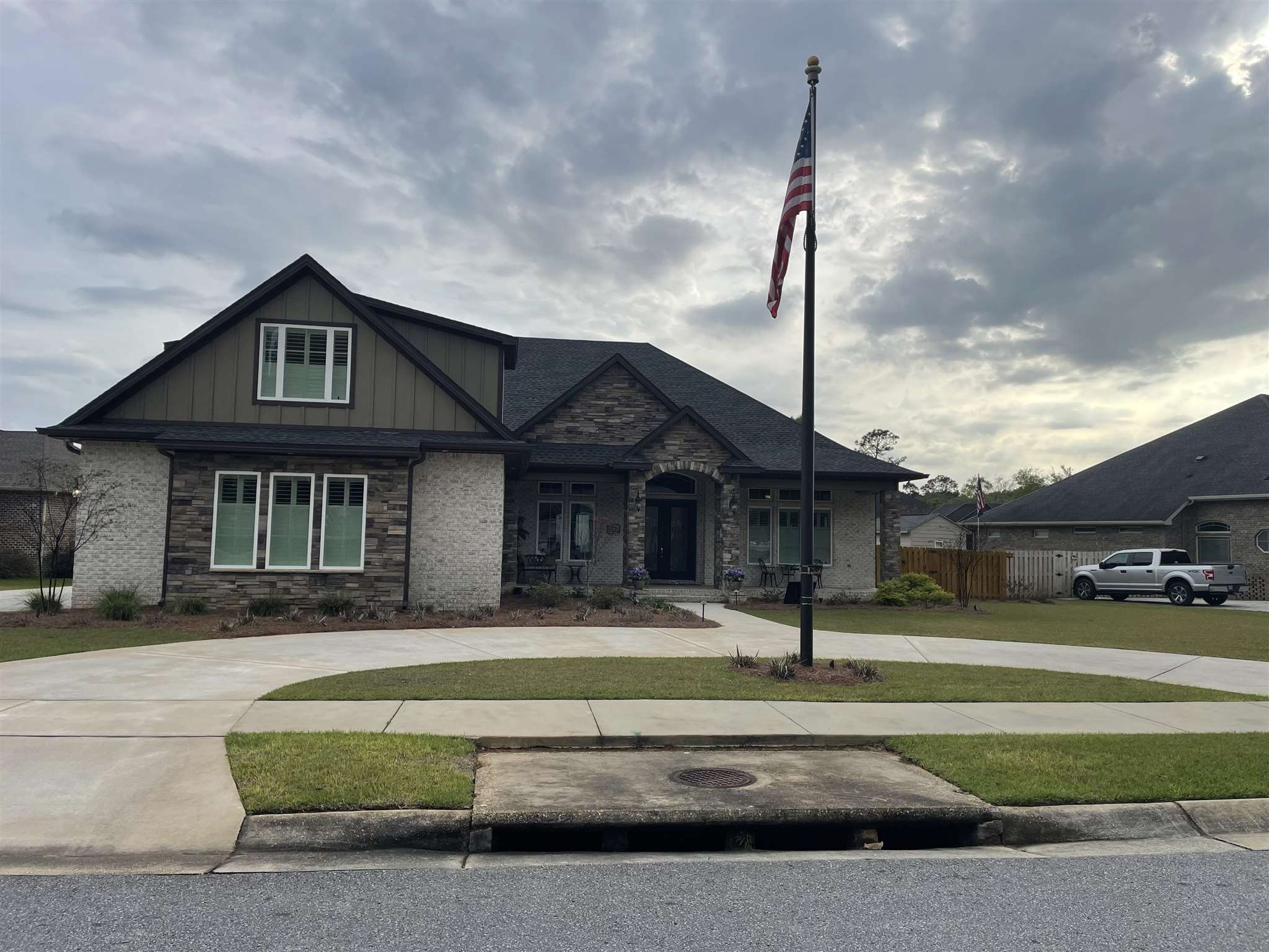 8389 Foxtail Loop Pensacola, FL 32526 - Photo 1 of 11 a front view of a house with a yard
