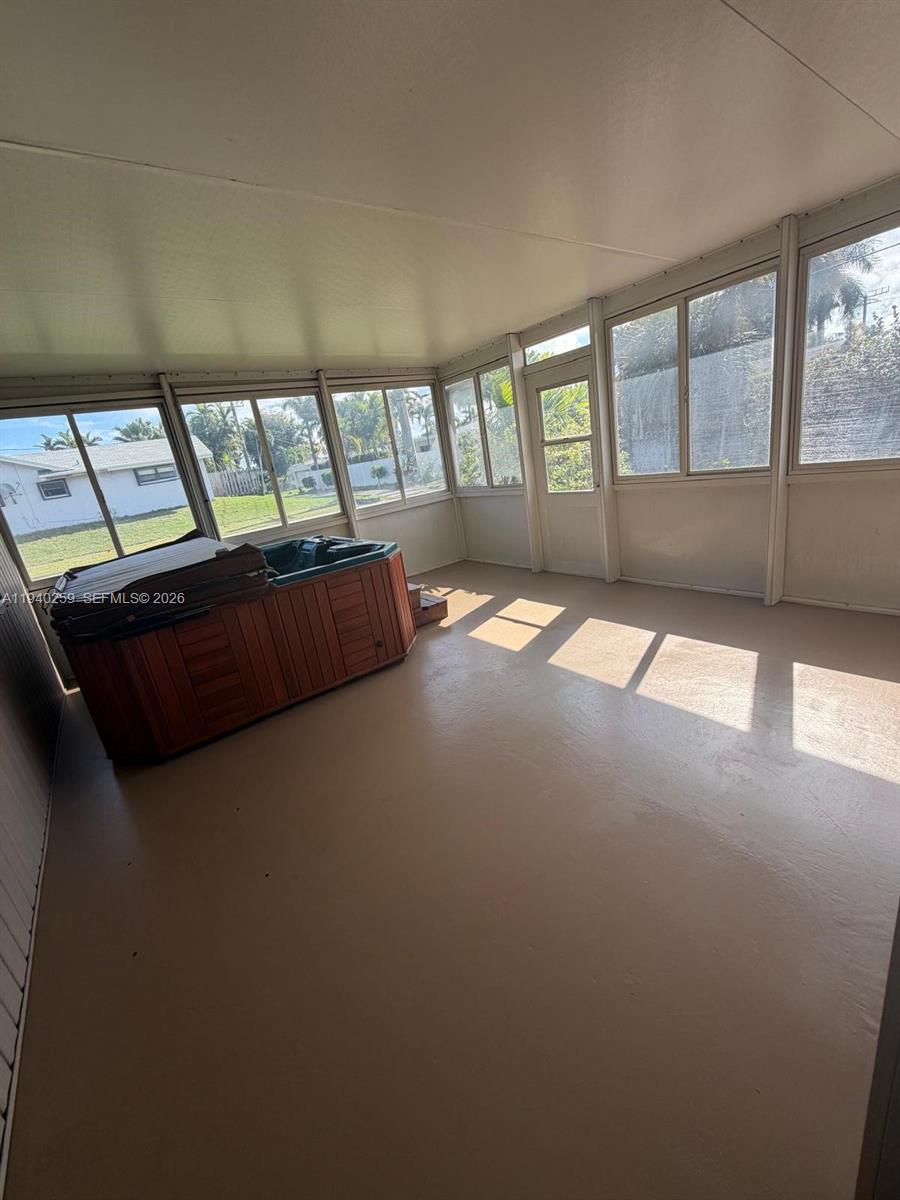 238 Southeast 3rd Street Dania Beach, FL 33004 - Photo 4 of 15 a living room with furniture and floor to ceiling window