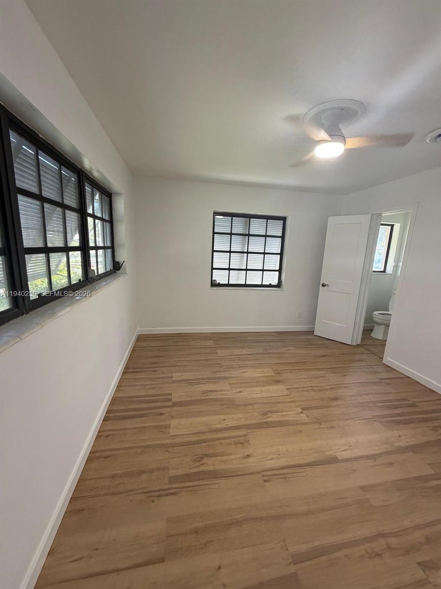 238 Southeast 3rd Street Dania Beach, FL 33004 - Photo 8 of 15 wooden floor in an empty room