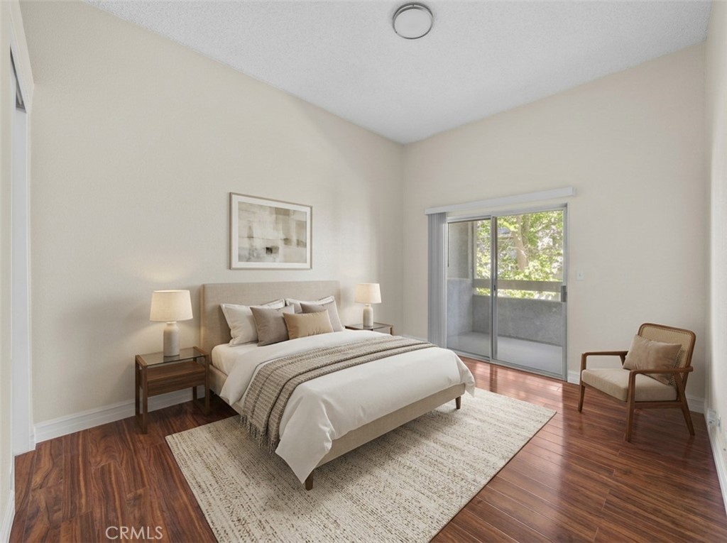 174 West Walnut Avenue, Unit B Rialto, CA 92376 - Photo 14 of 25 a bedroom with a bed and a window
