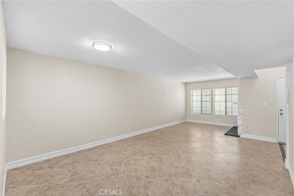 174 West Walnut Avenue, Unit B Rialto, CA 92376 - Photo 5 of 25 an empty room with windows