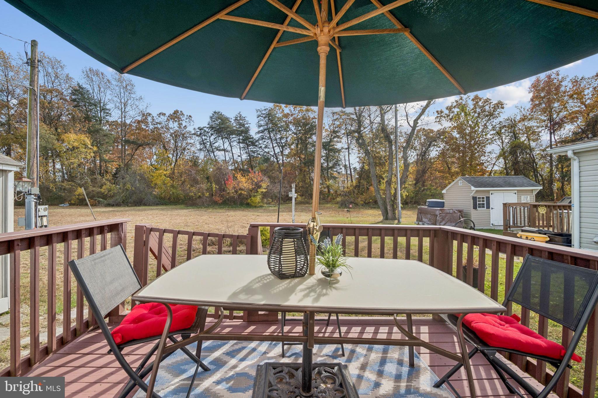 7959 Telegraph Road, Unit 5 Severn, MD 21144 - Photo 12 of 14 a view of balcony with furniture and umbrella
