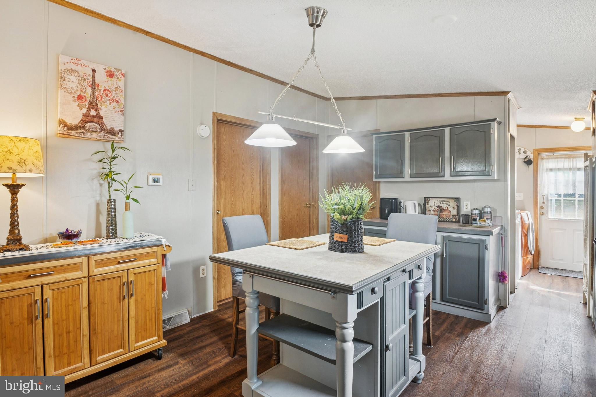 7959 Telegraph Road, Unit 5 Severn, MD 21144 - Photo 6 of 14 a view of a kitchen area with furniture and wooden floor