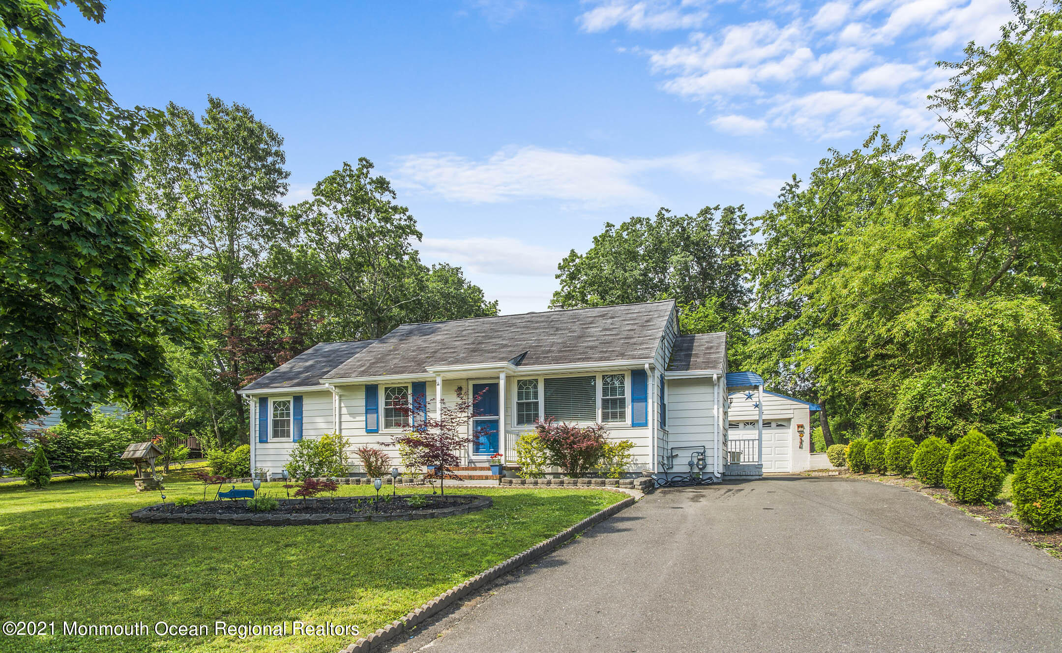 9 Pine Road Howell, NJ 07731 - Photo 1 of 26 a front view of a house with a yard table and chairs