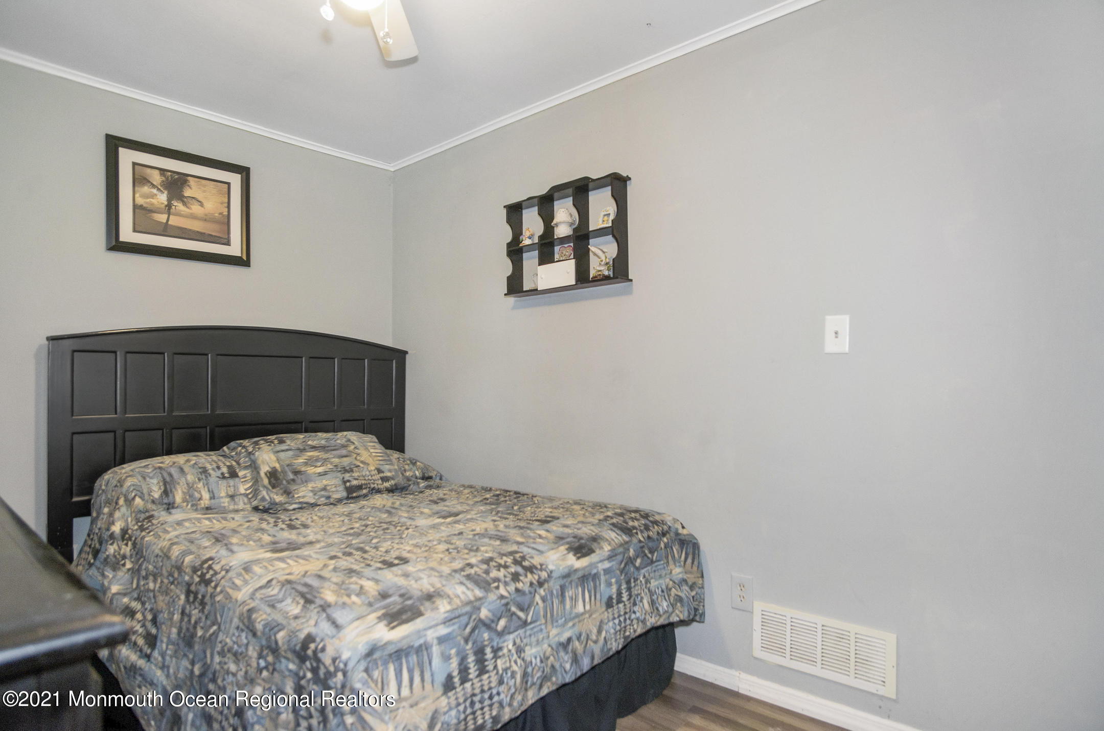 9 Pine Road Howell, NJ 07731 - Photo 11 of 26 a bedroom with a bed and painting on the wall