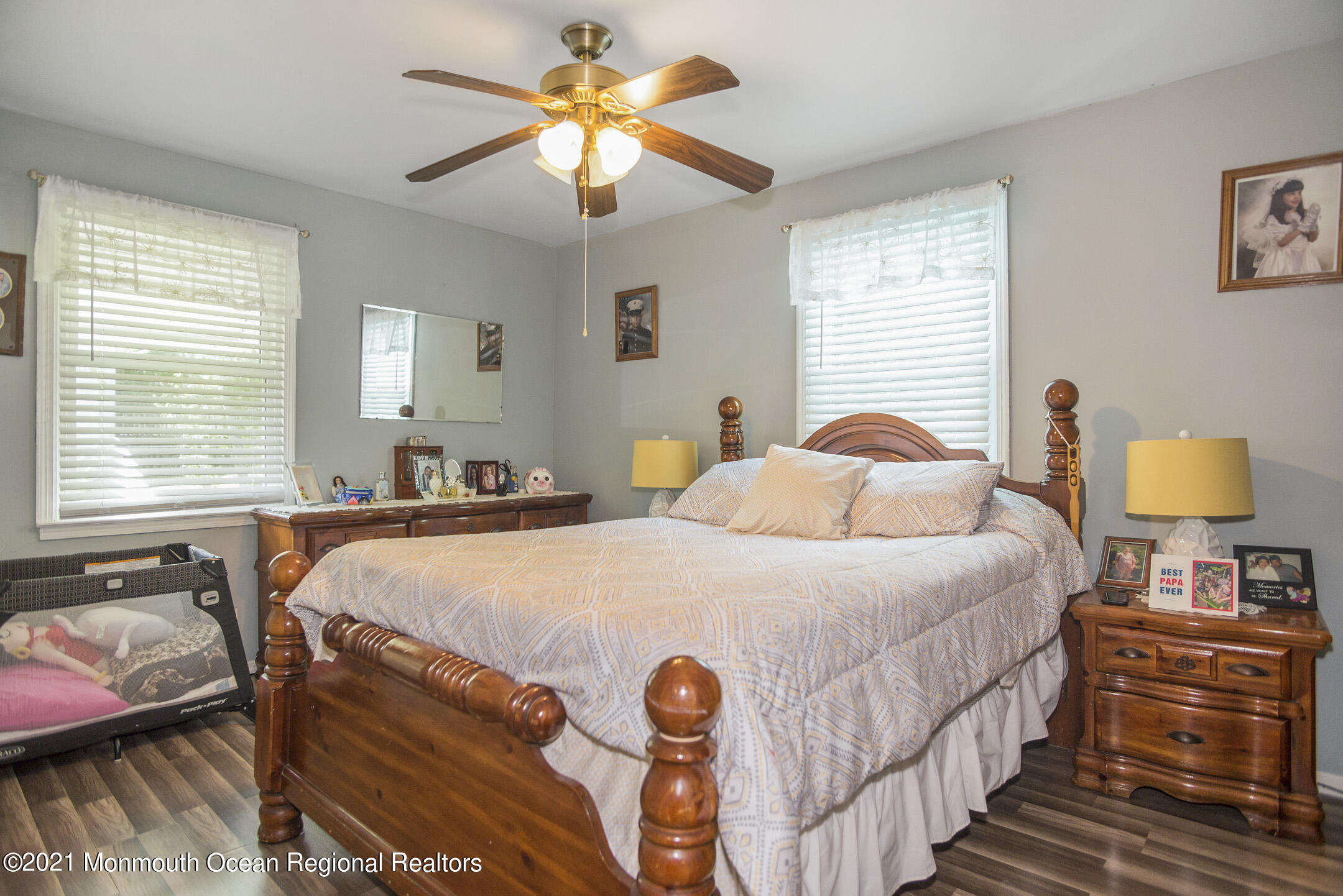 9 Pine Road Howell, NJ 07731 - Photo 12 of 26 a bedroom with a bed and a chandelier