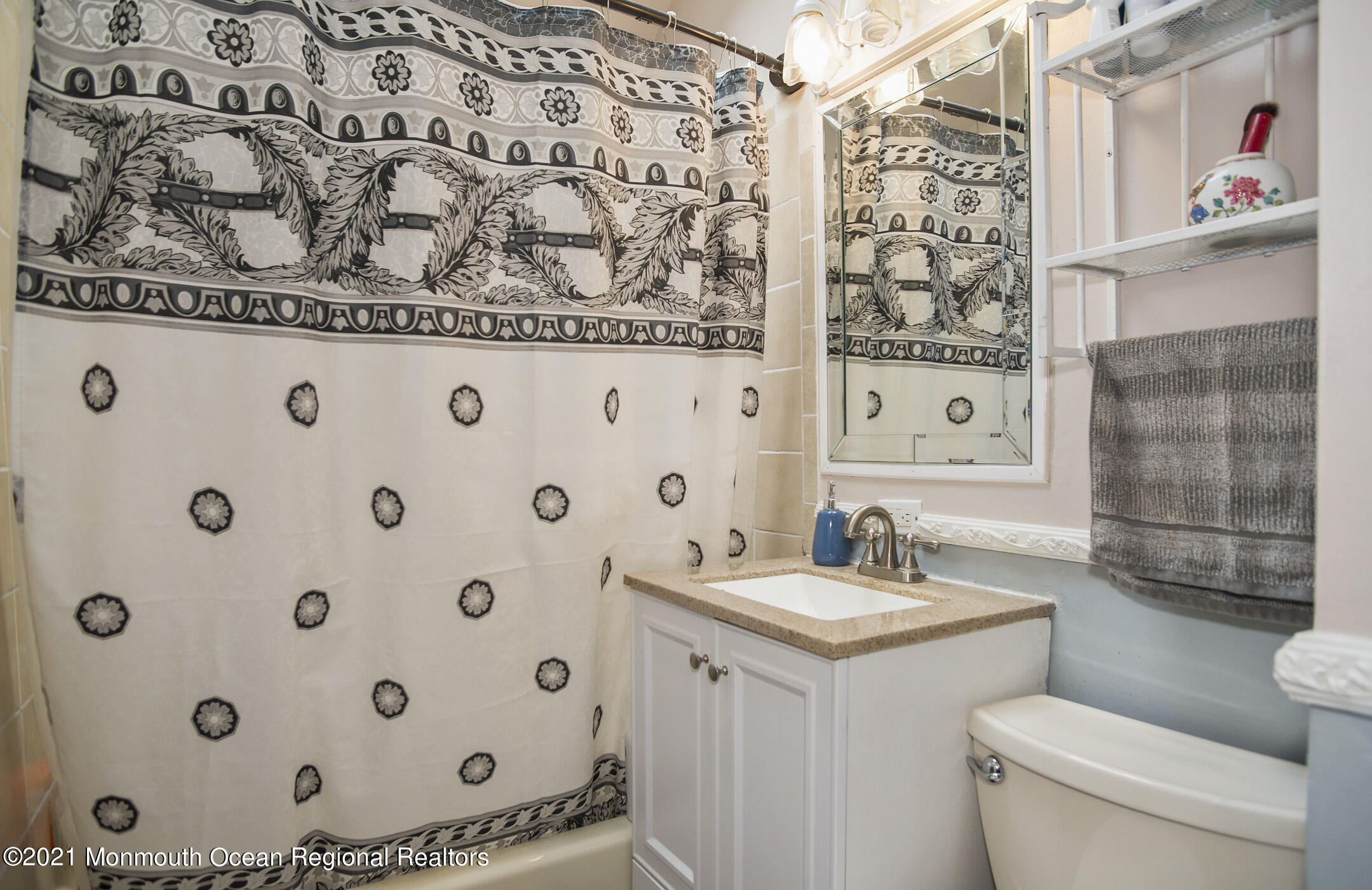 9 Pine Road Howell, NJ 07731 - Photo 13 of 26 a bathroom with a sink and a mirror