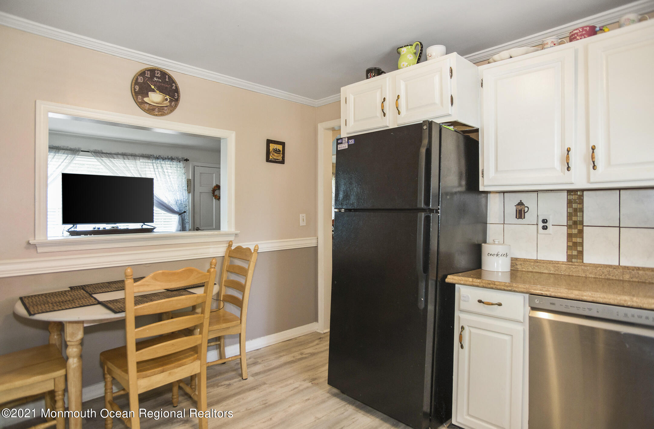 9 Pine Road Howell, NJ 07731 - Photo 18 of 26 a kitchen with a refrigerator and a stove top oven