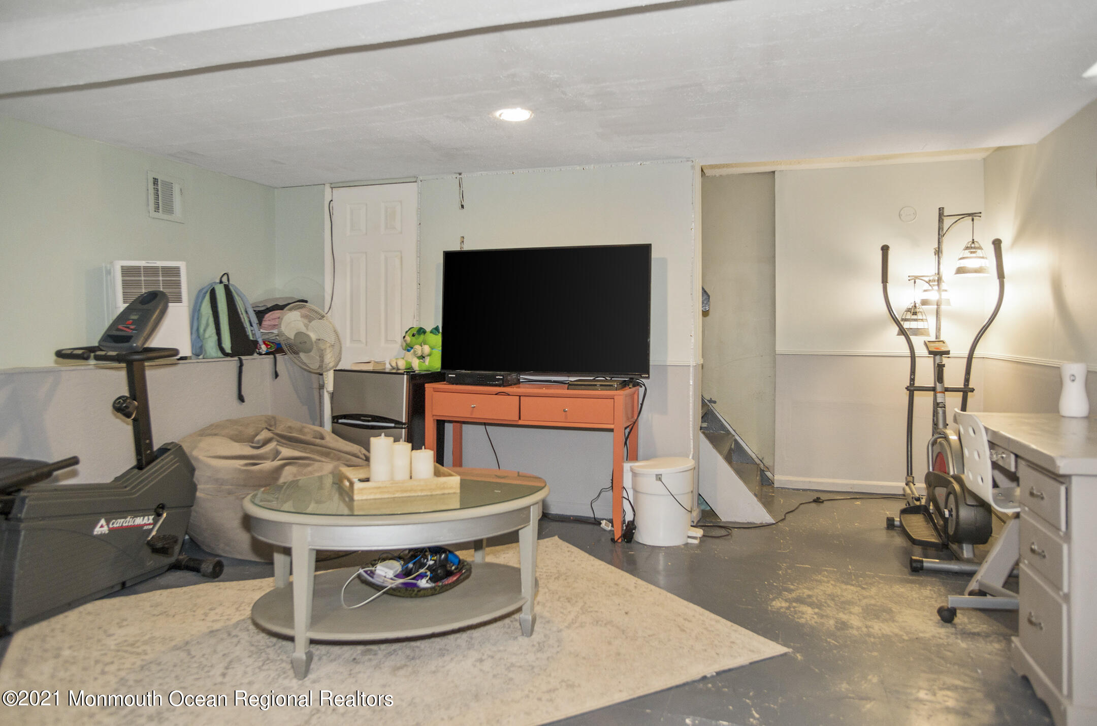 9 Pine Road Howell, NJ 07731 - Photo 21 of 26 a room with furniture and a flat screen tv