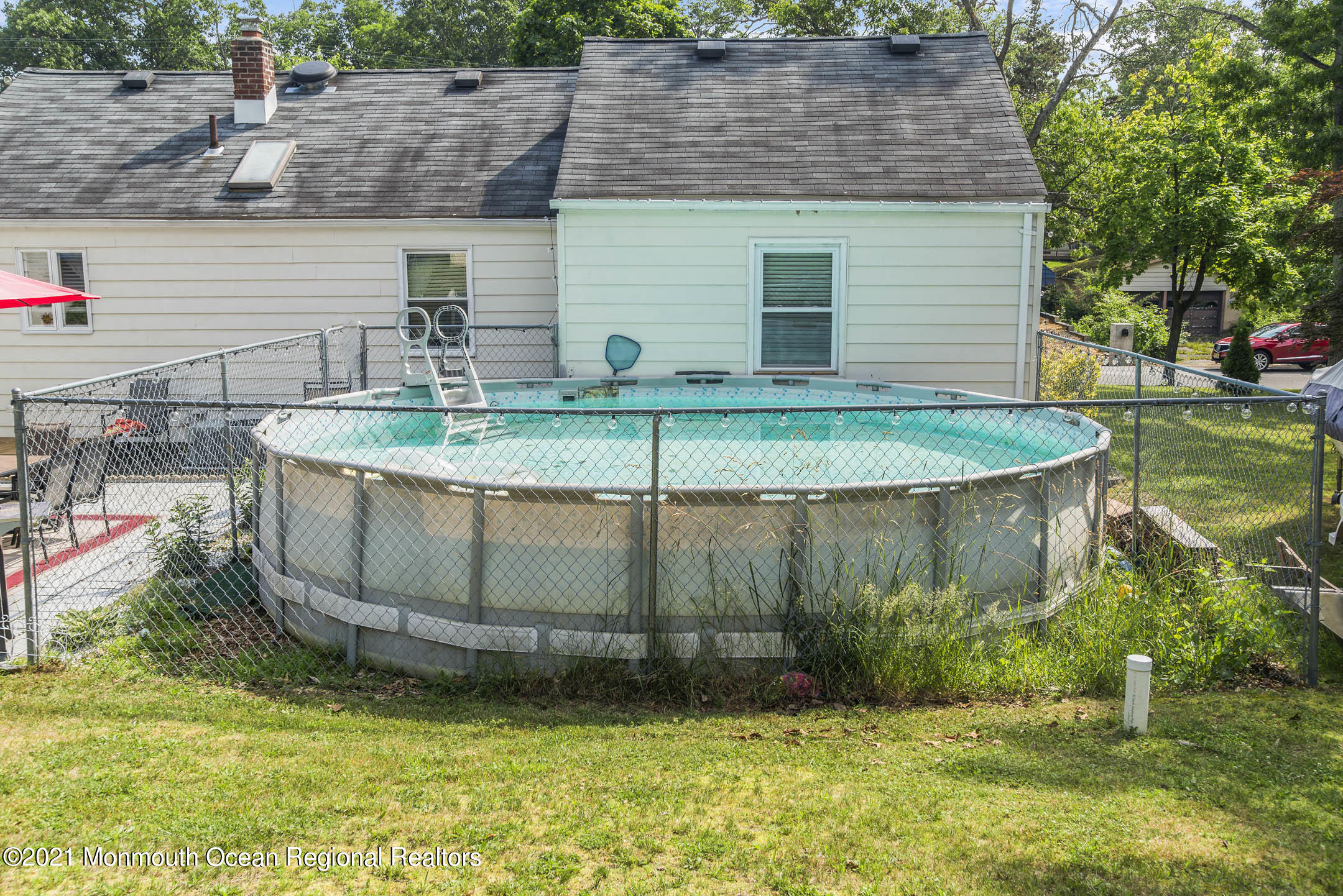 9 Pine Road Howell, NJ 07731 - Photo 25 of 26 a view of a backyard with plants and brick wall