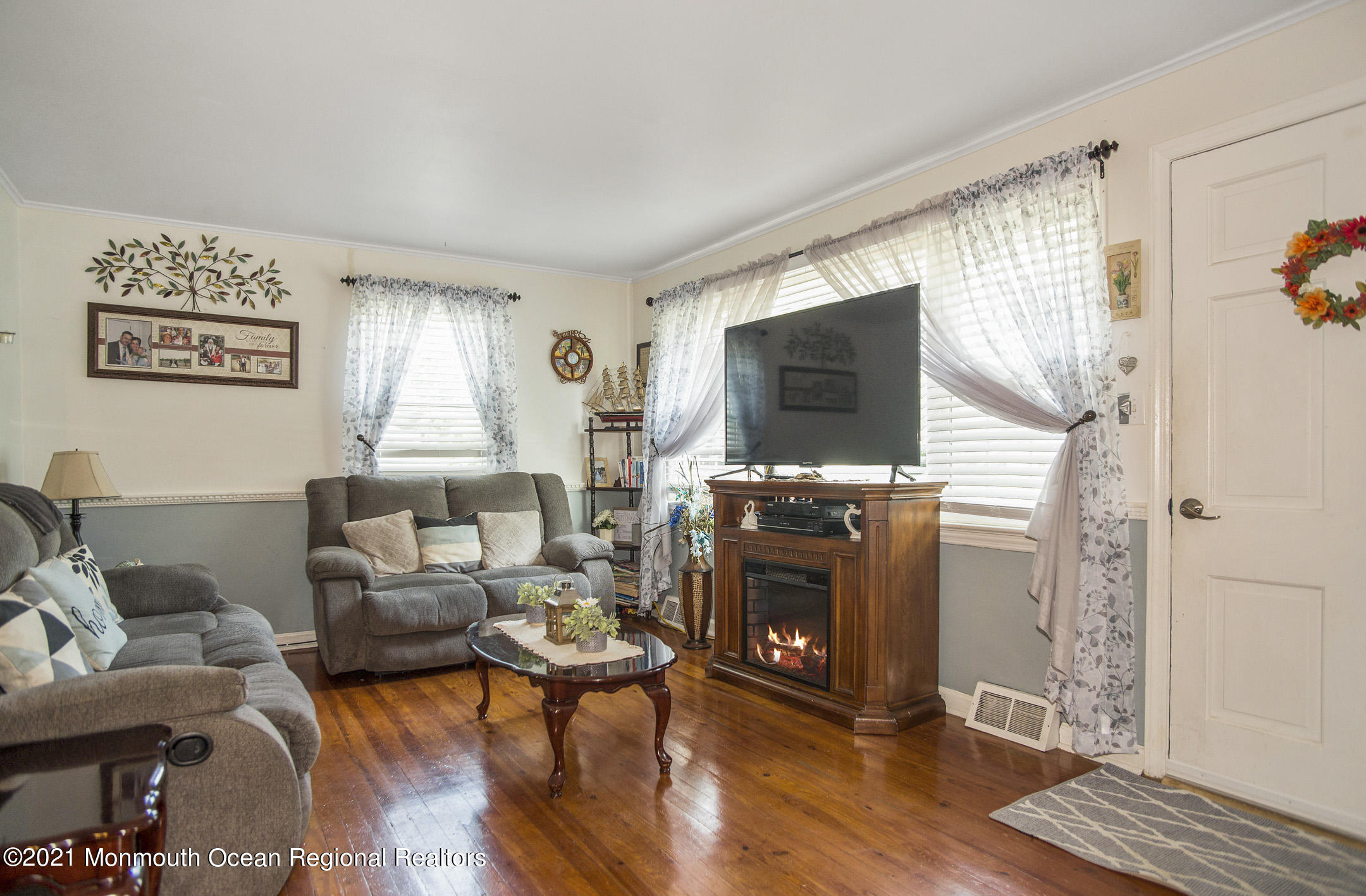 9 Pine Road Howell, NJ 07731 - Photo 5 of 26 a living room with furniture and a flat screen tv