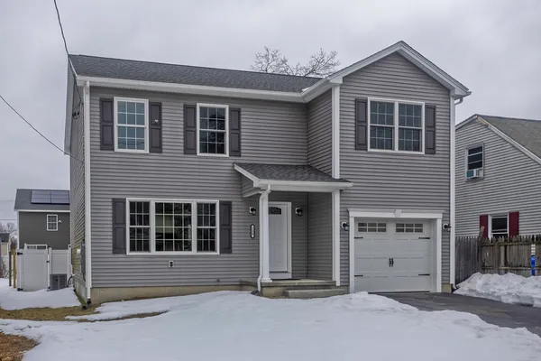 a front view of a house with a garage