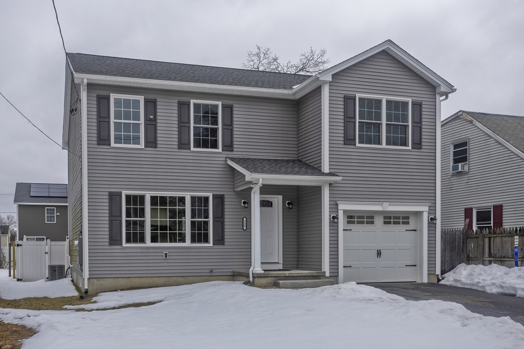 a front view of a house with a garage