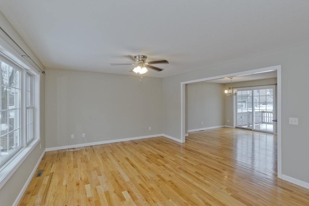 239 Gresham Street Springfield, MA 01119 - Photo 14 of 39 a view of an empty room with wooden floor and a window