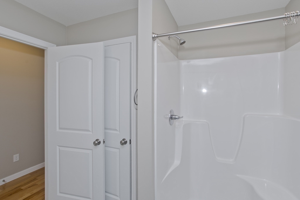 239 Gresham Street Springfield, MA 01119 - Photo 21 of 39 a bathroom with a glass shower door