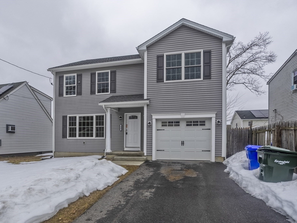 239 Gresham Street Springfield, MA 01119 - Photo 4 of 39 a view of a house with a yard