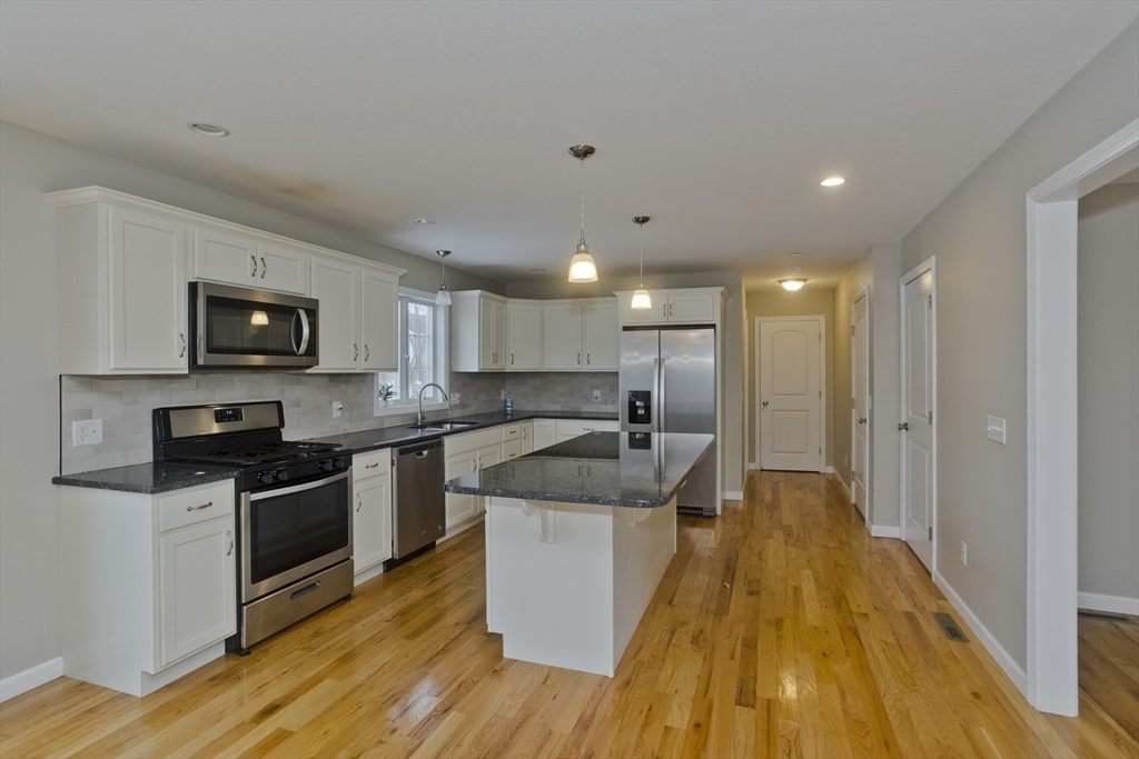239 Gresham Street Springfield, MA 01119 - Photo 7 of 39 a kitchen with a sink appliances and cabinets