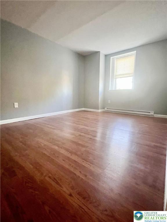 272 St John Street, Unit 5 Easton, PA 18042 - Photo 3 of 9 an empty room with wooden floor and windows