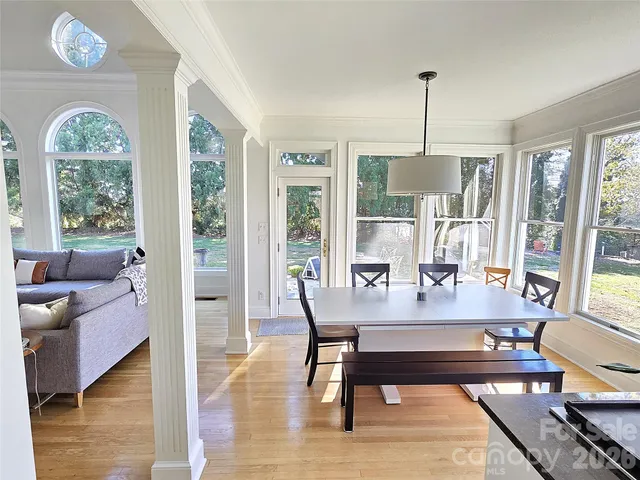 a view of a livingroom with furniture window and wooden floor