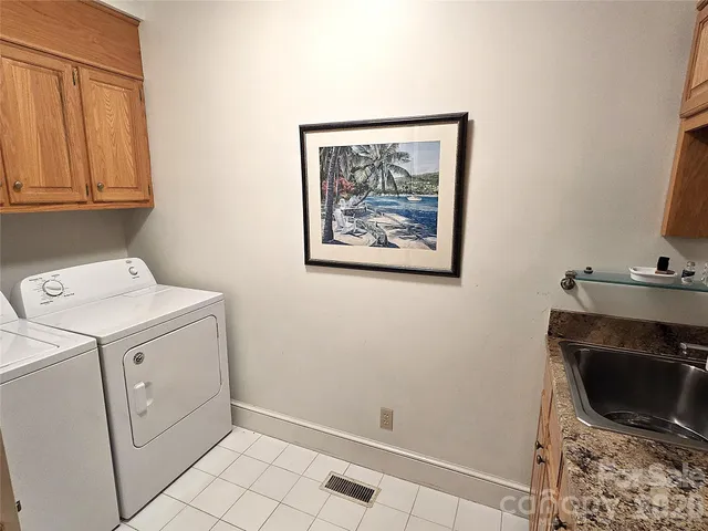 a view of storage and utility room with washer and dryer