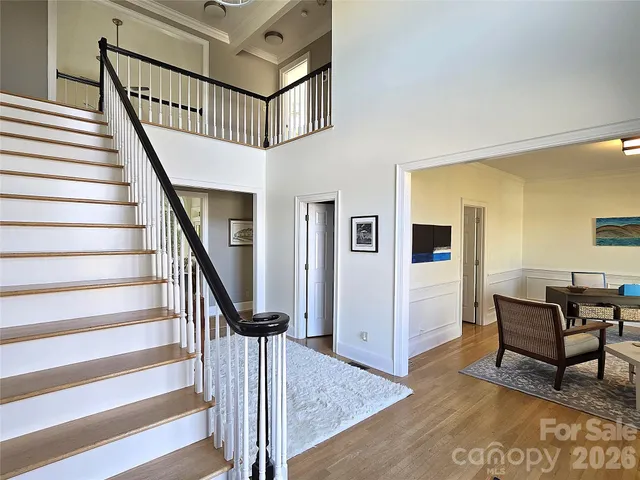 a view of entryway livingroom and hall with wooden floor