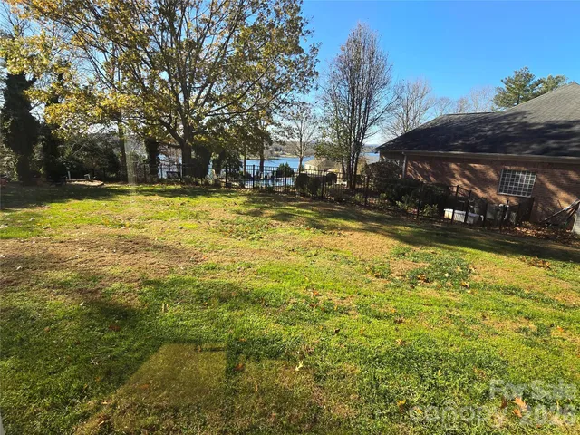 a view of swimming pool with trees