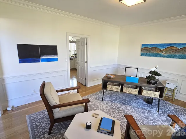 a living room with furniture and a rug