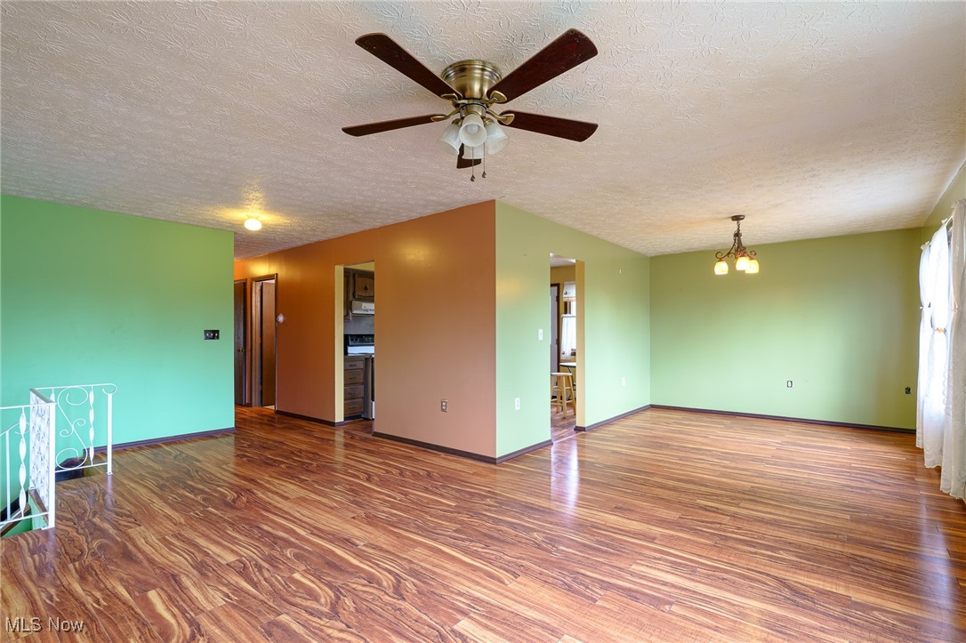 6747 Giddings Road Rootstown, OH 44272 - Photo 6 of 39 Living room showing large dining room and entrances to kitchen