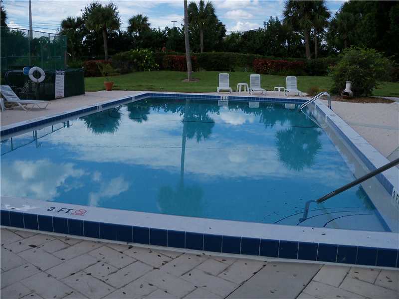 9639 Riverside Drive Sebastian, FL 32958 - Photo 3 of 8 a view of a swimming pool with a yard