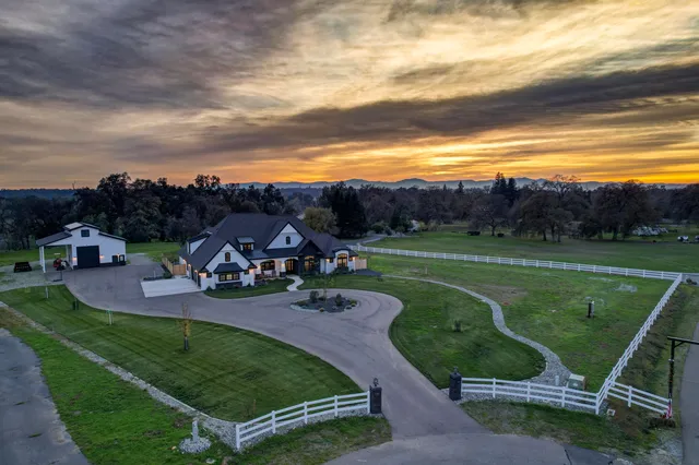 a large kitchen with a table and chairs