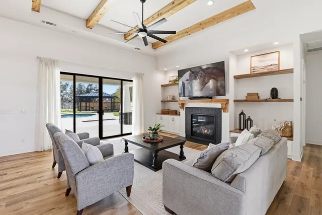 a bathroom with a toilet and a shower curtain