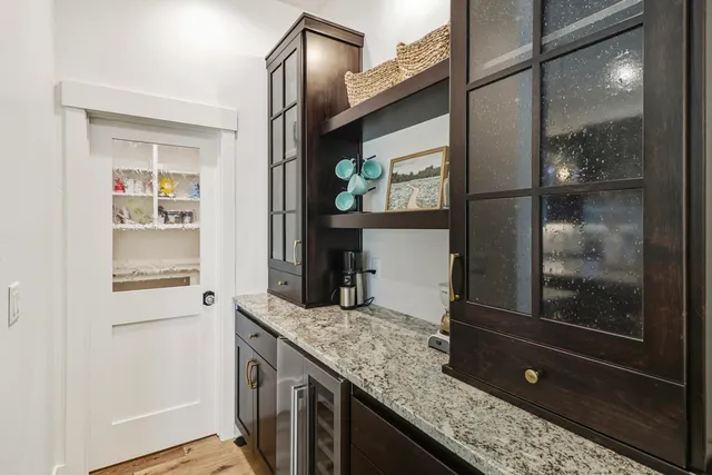 a bedroom with a bed a couch and a flat screen tv