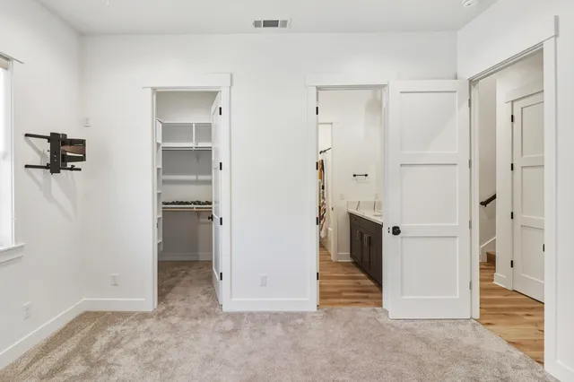 a view of a livingroom with a ceiling fan and window