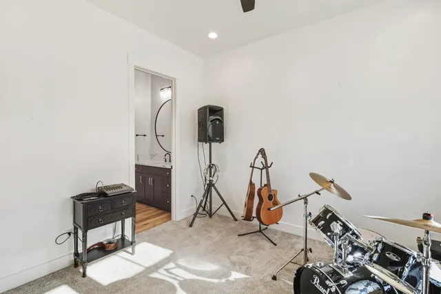 an aerial view of a house with garden space and ocean view