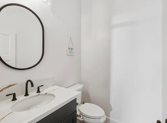 a front view of a house with a yard table and chairs