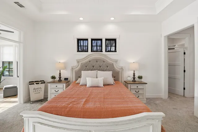 a view of a livingroom with a hardwood floor and a ceiling fan