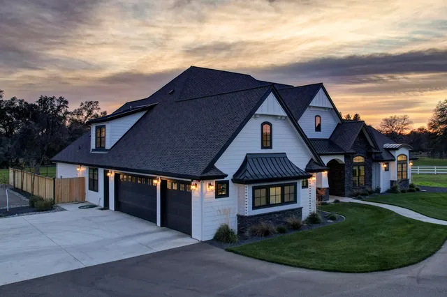 a living room with furniture a rug and a flat screen tv