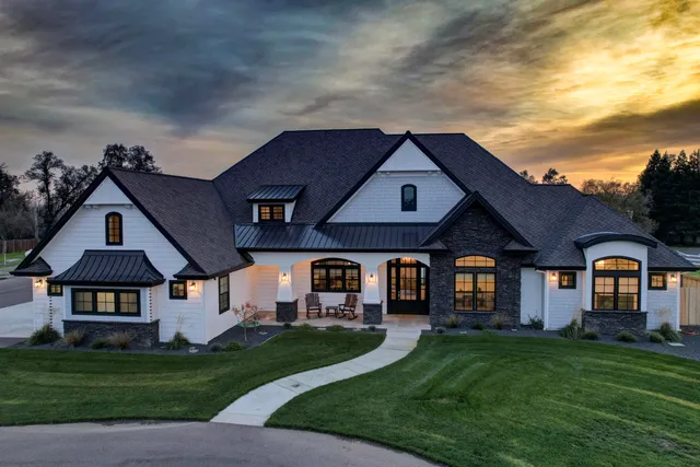 a living room with furniture a fireplace and a window