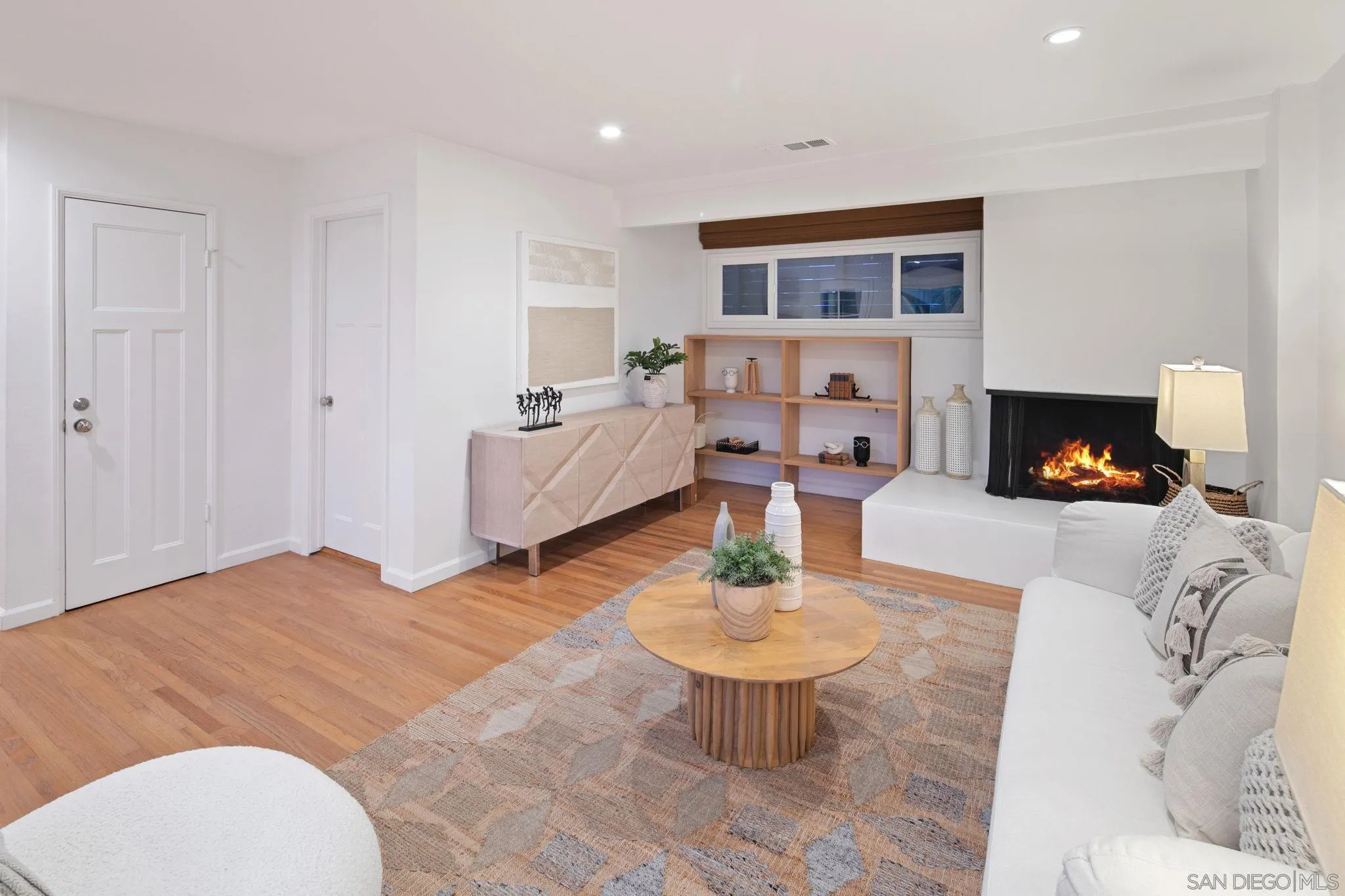 211 Ocean Street Solana Beach, CA 92075 - Photo 19 of 29 a living room with furniture and a fireplace