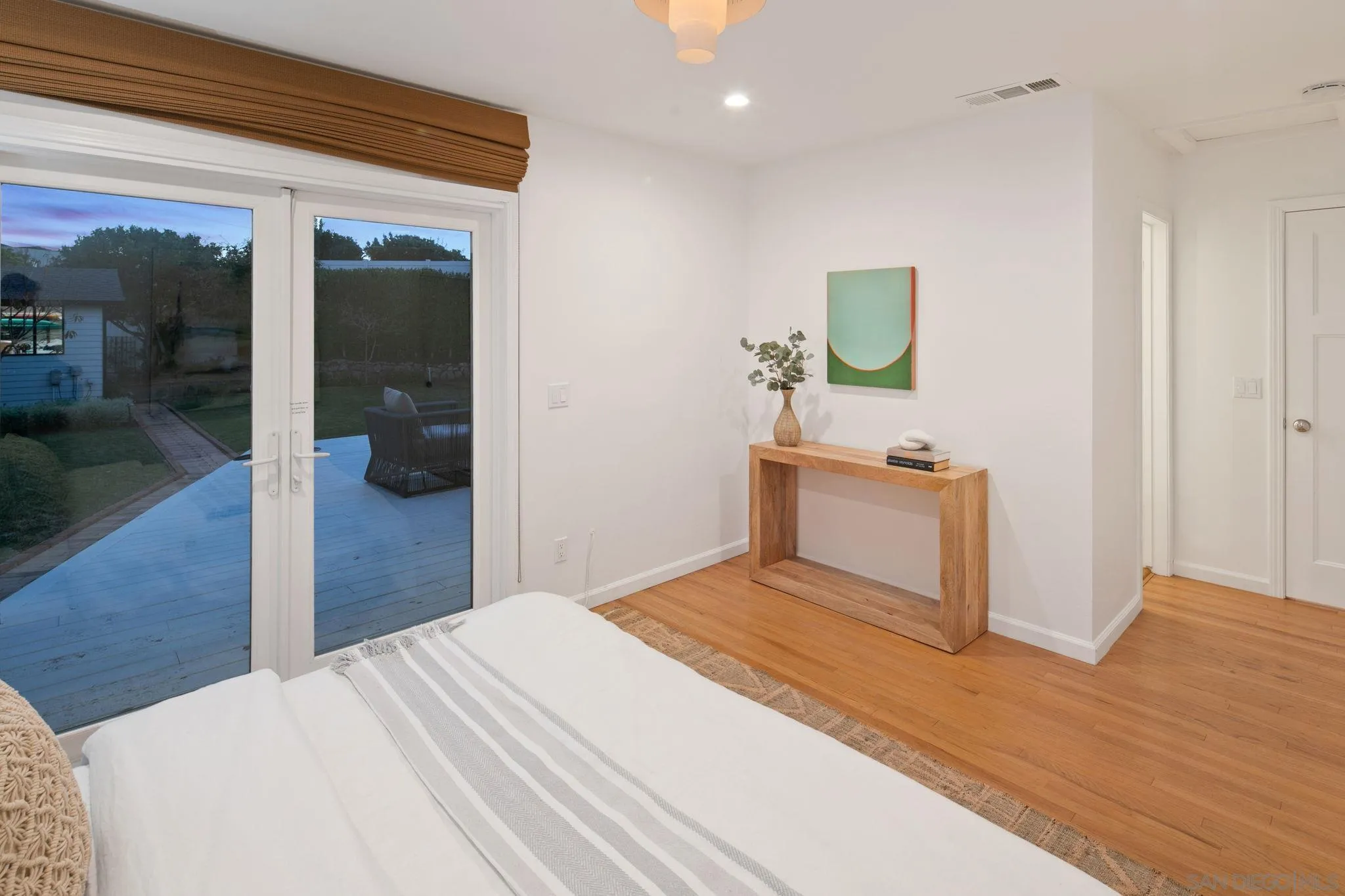 211 Ocean Street Solana Beach, CA 92075 - Photo 24 of 29 a bedroom with a bed and a potted plant