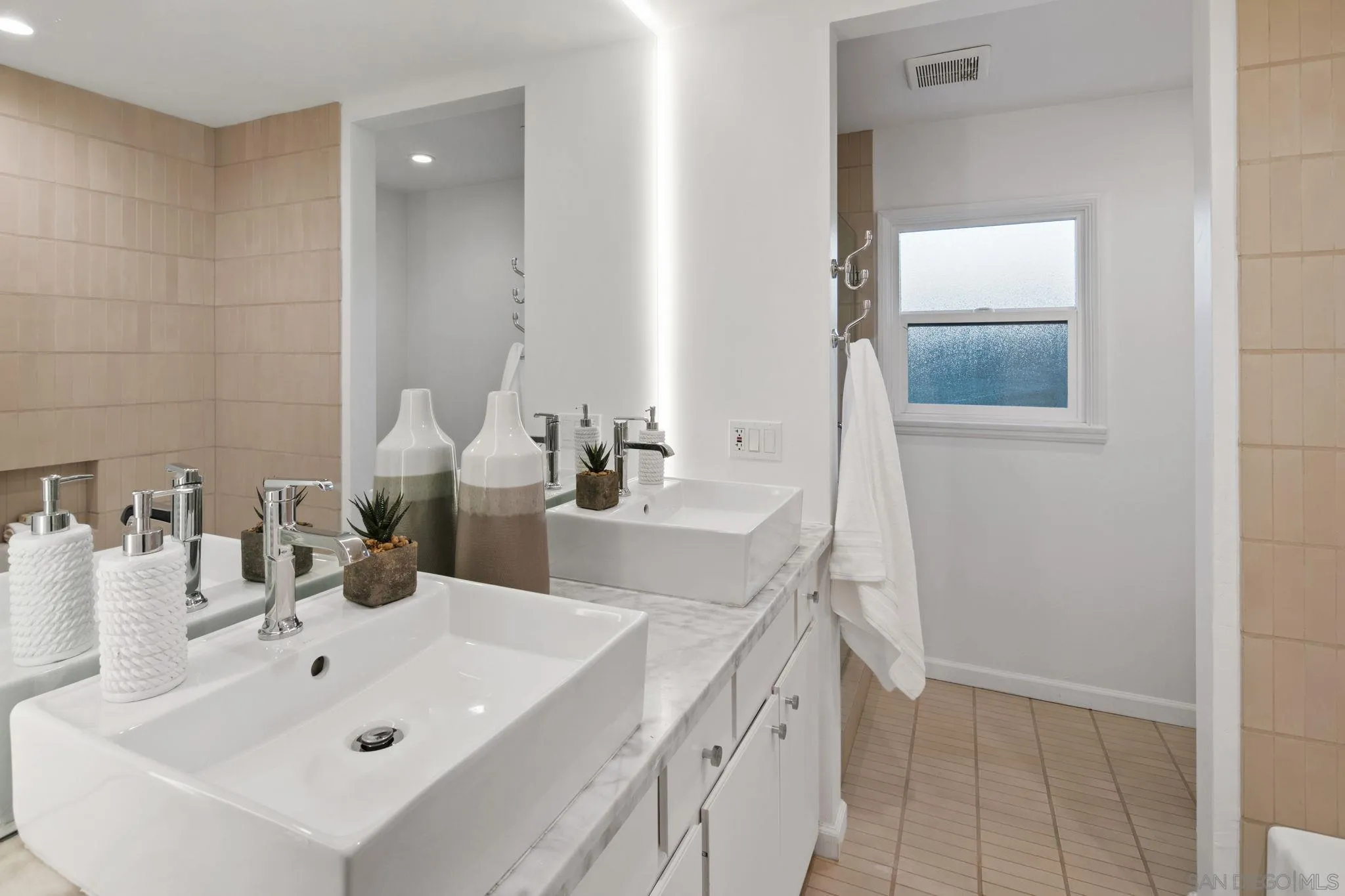 211 Ocean Street Solana Beach, CA 92075 - Photo 25 of 29 a bathroom with a sink and a mirror