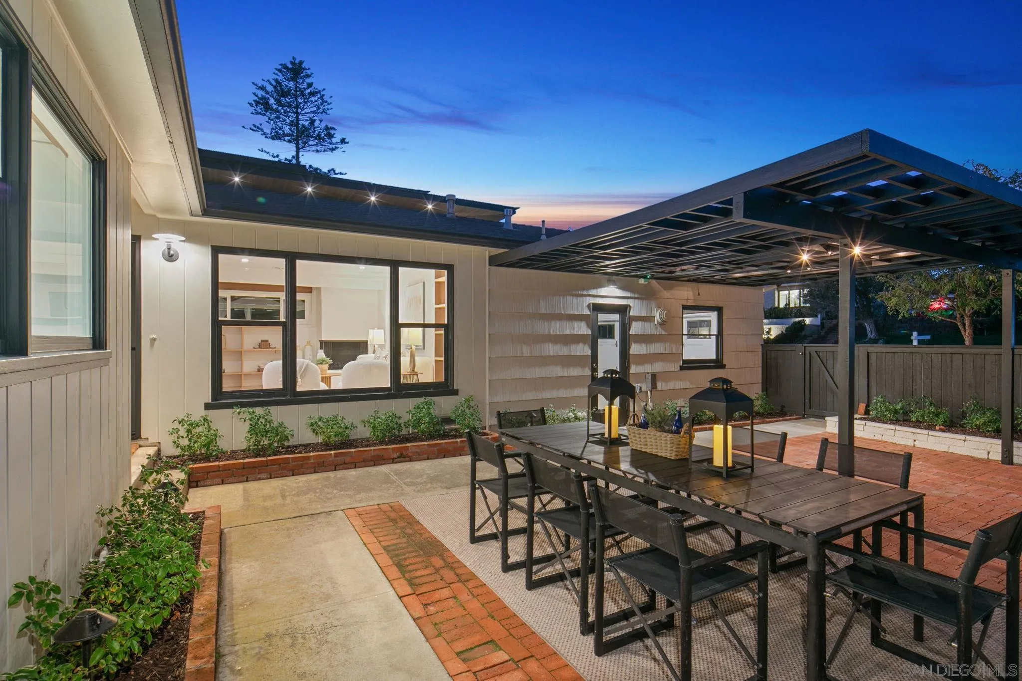 211 Ocean Street Solana Beach, CA 92075 - Photo 10 of 29 a view of a patio with table and chairs with wooden floor and plants